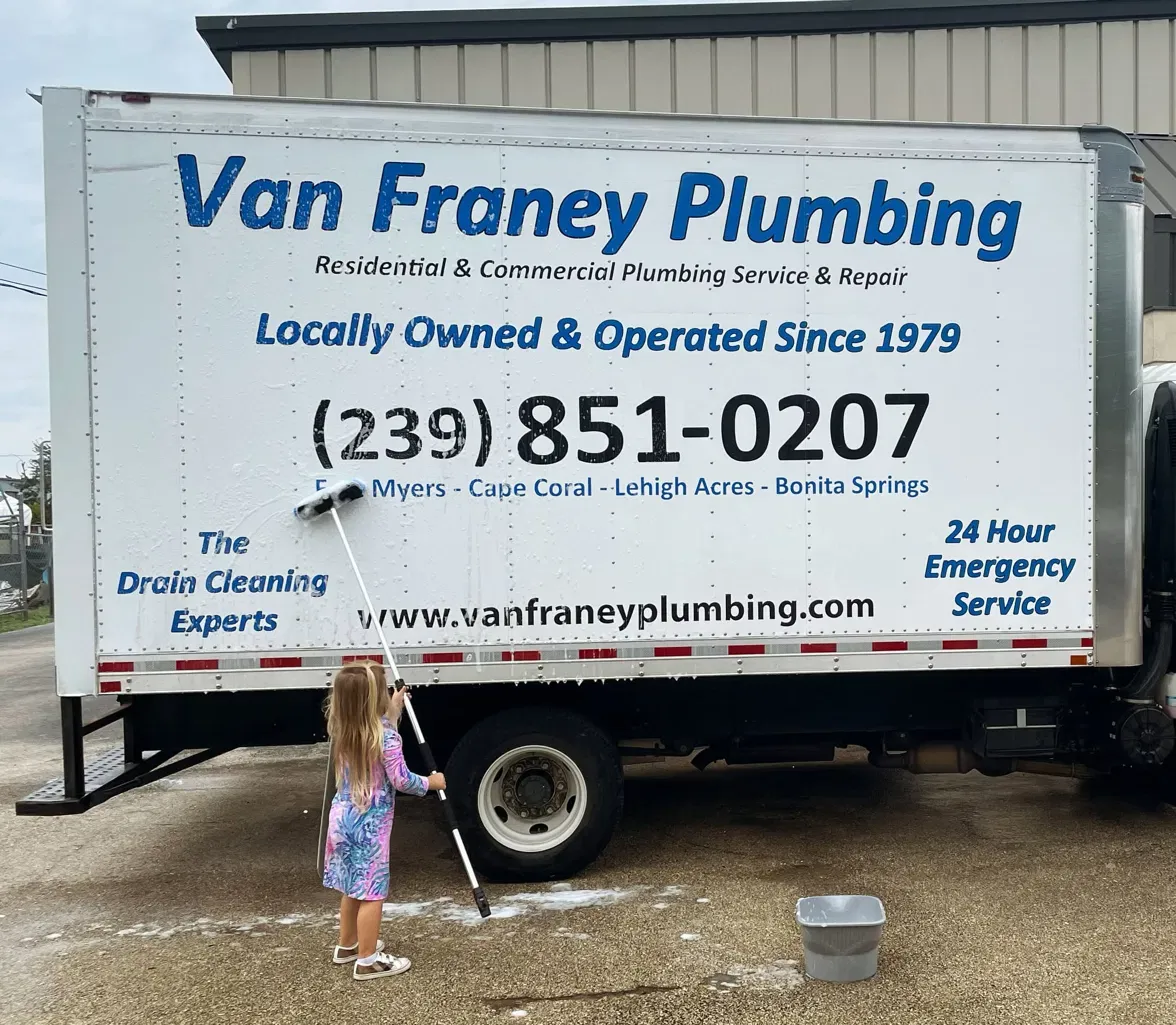 The founder's granddaughter washing the box truck